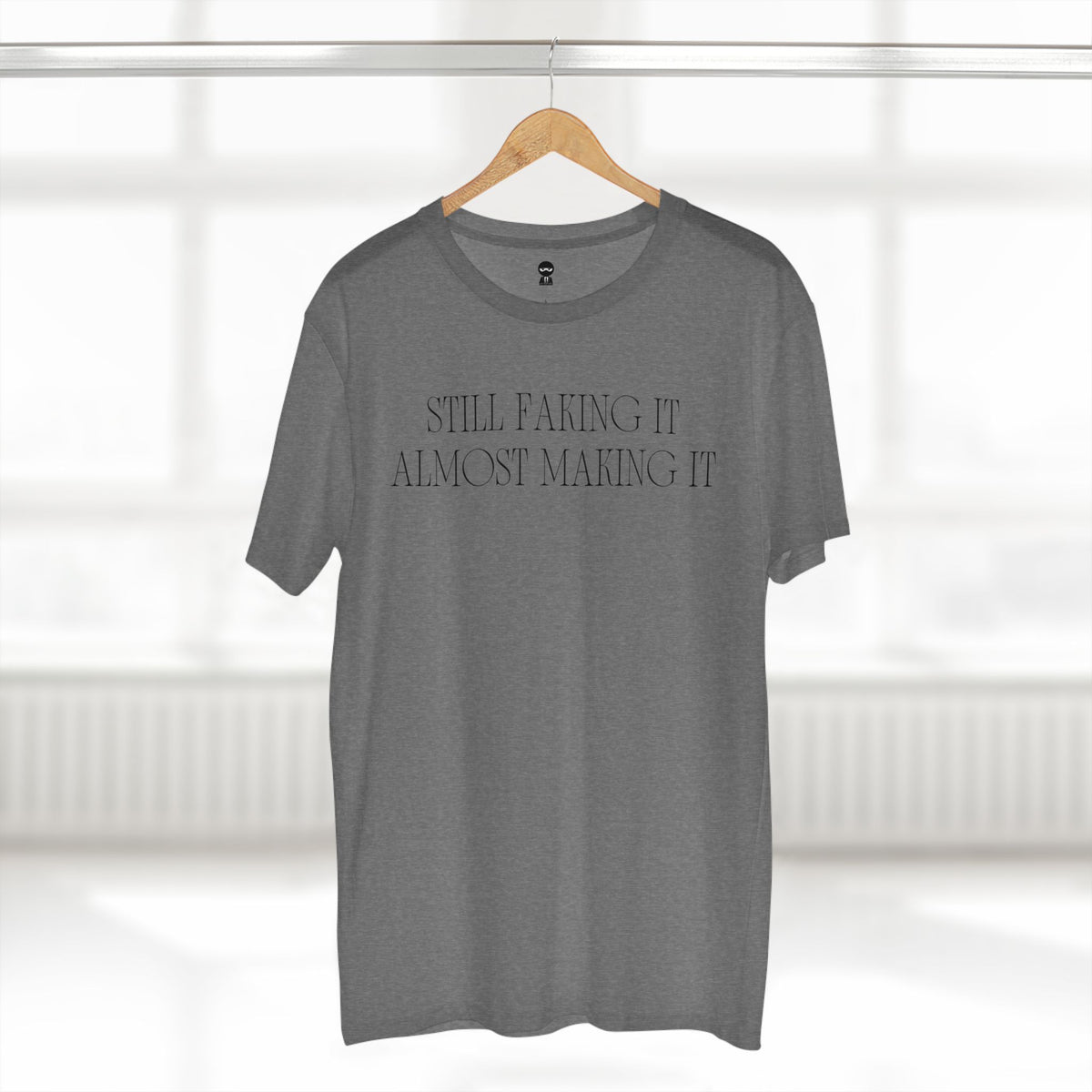 T-shirt printed with the Still Faking It design