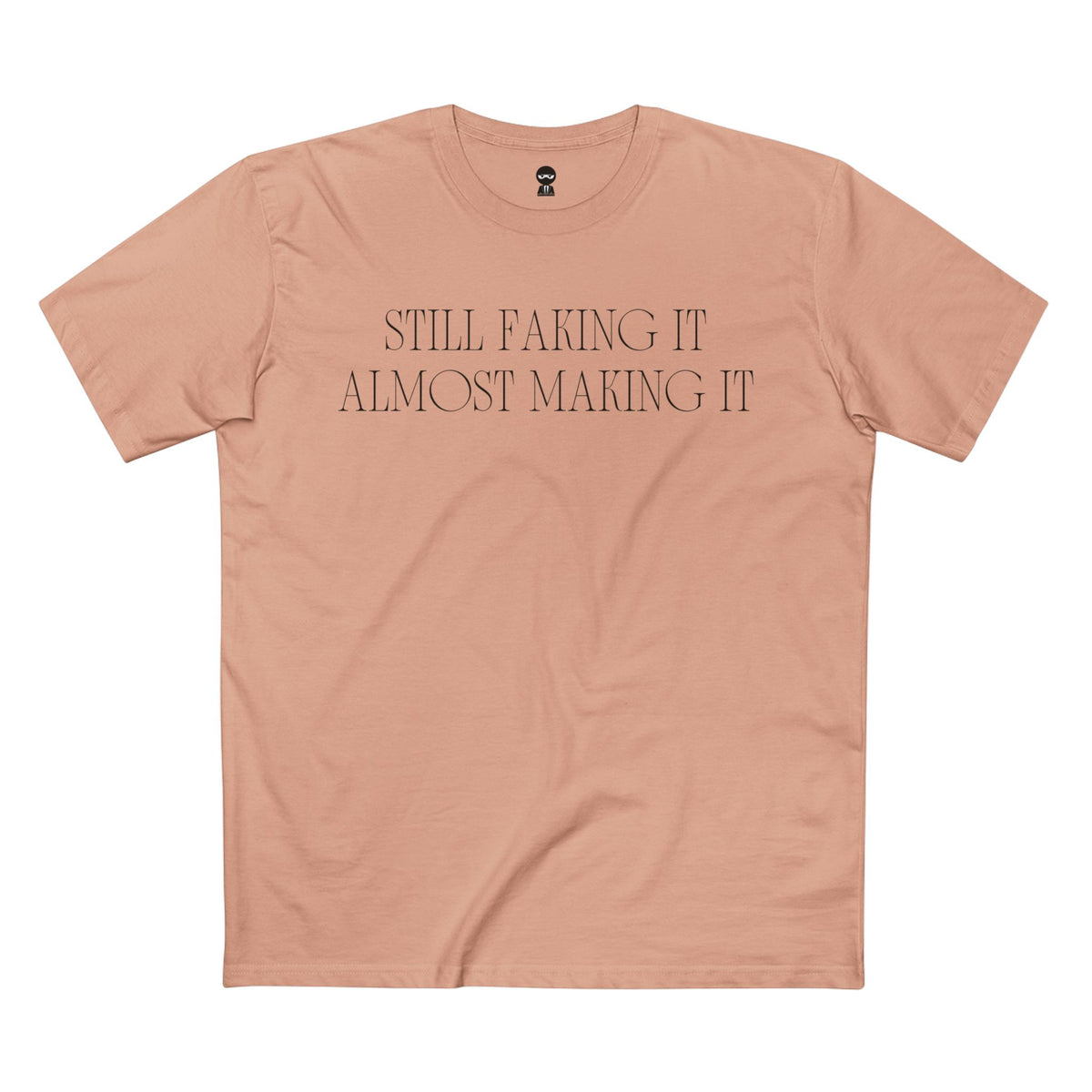 Pale Pink t-shirt printed with the Still Faking It design