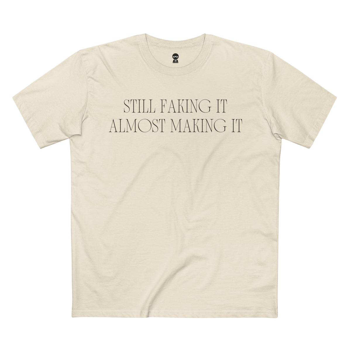 Natural t-shirt printed with the Still Faking It design